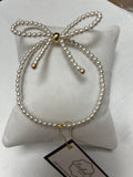 Pearl Bow Bracelet with Gold Accents